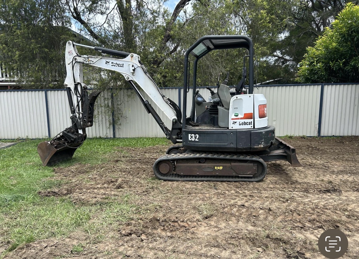 Bobcat E32 excavator on a residential earthworks site